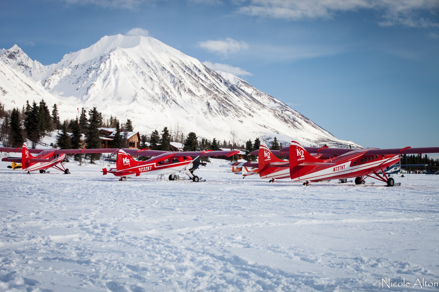 Classic K2 Aviation red planes parked at Rainy Pass checkpoint during Iditarod